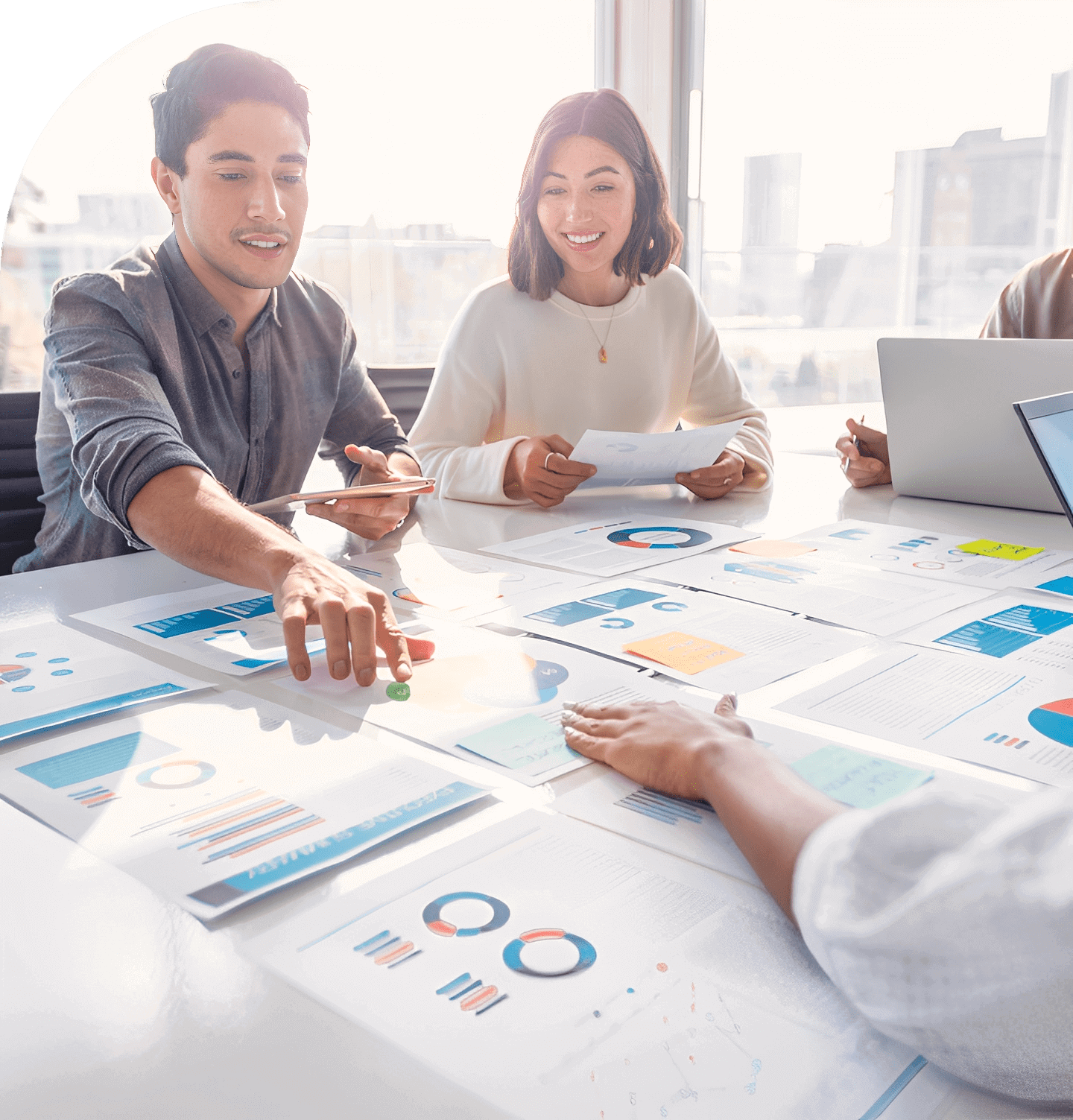 Team discussing charts in a bright office.