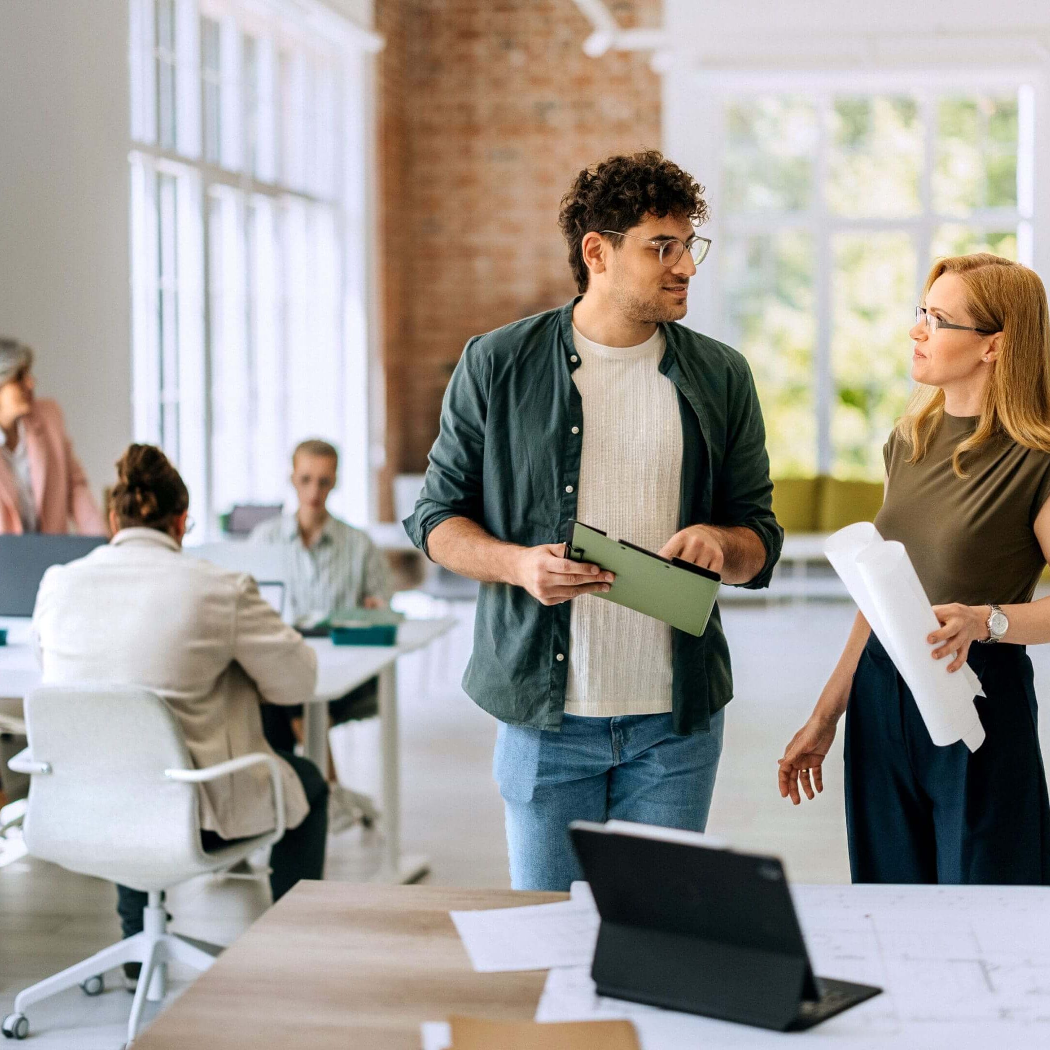 Young professionals collaborating in a modern office space.
